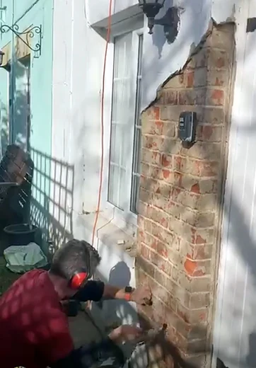Repairing render and brickwork on a wall